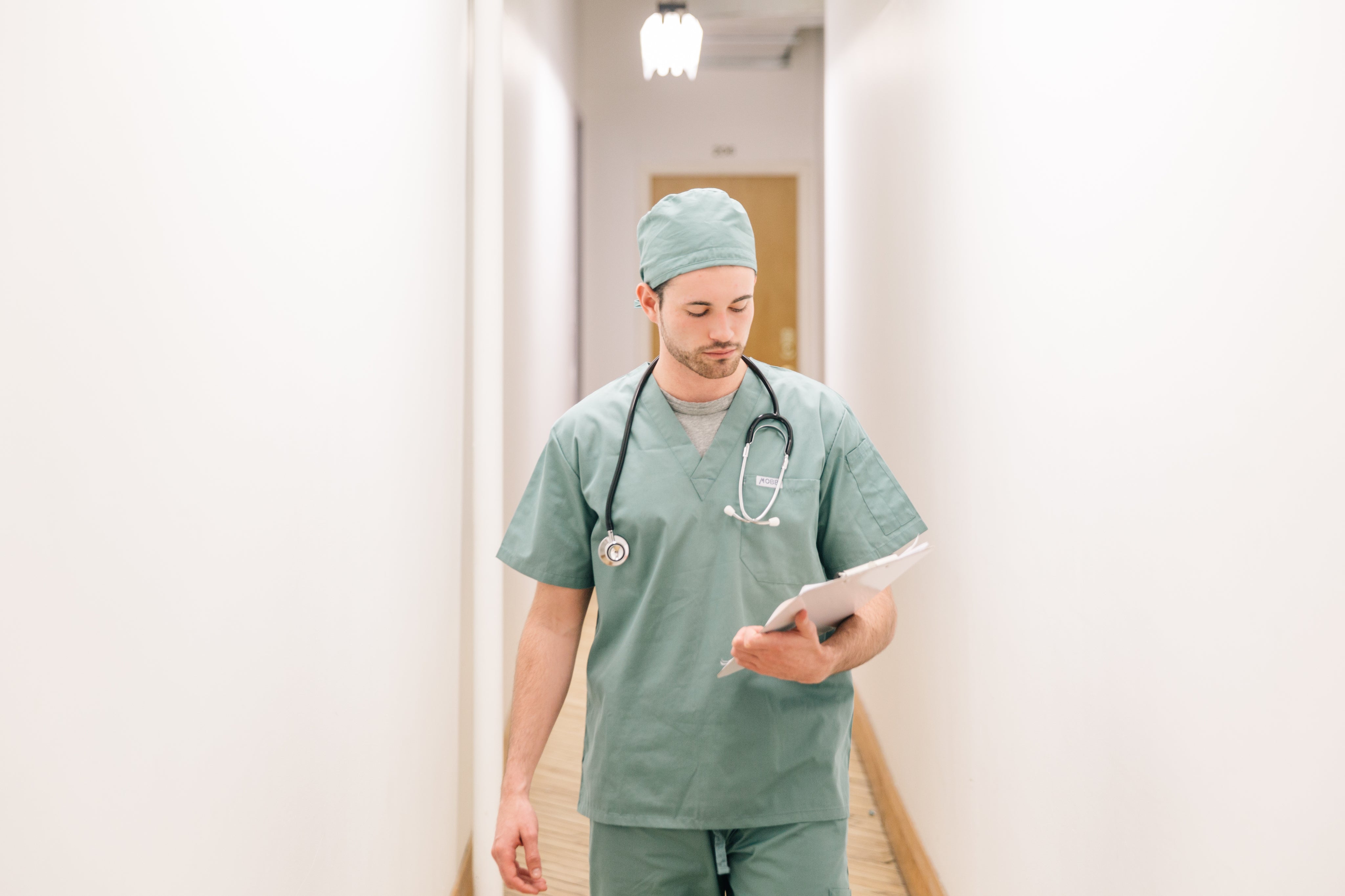 files/doctor-walking-down-hallway-with-clipboard.jpg